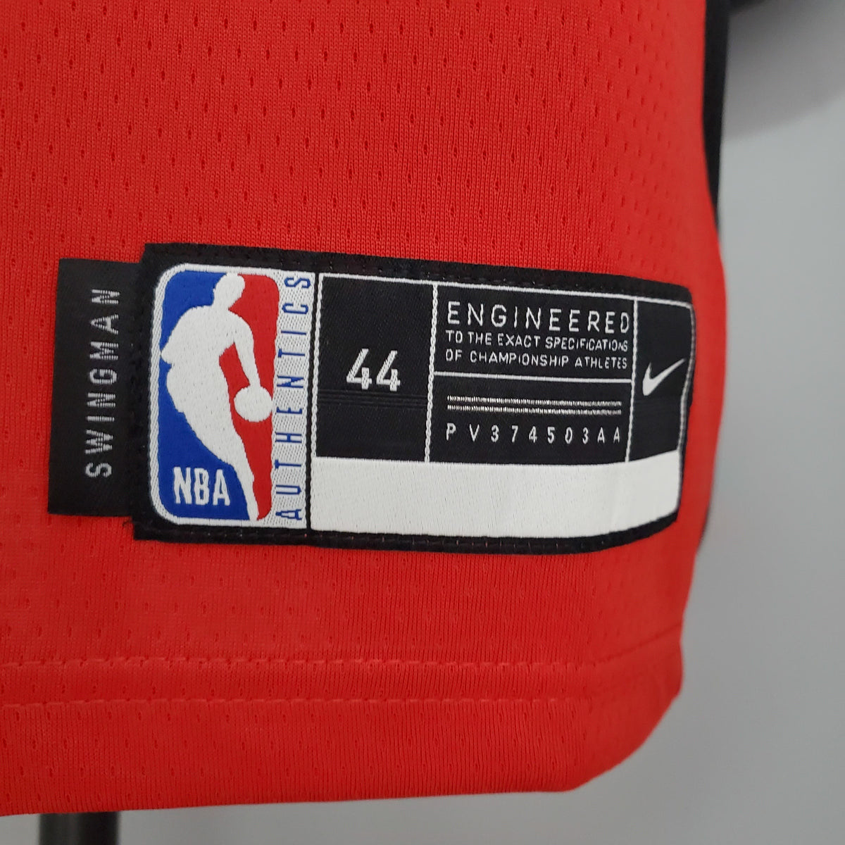 White Harden name and number 13 on the back of red Rockets jersey