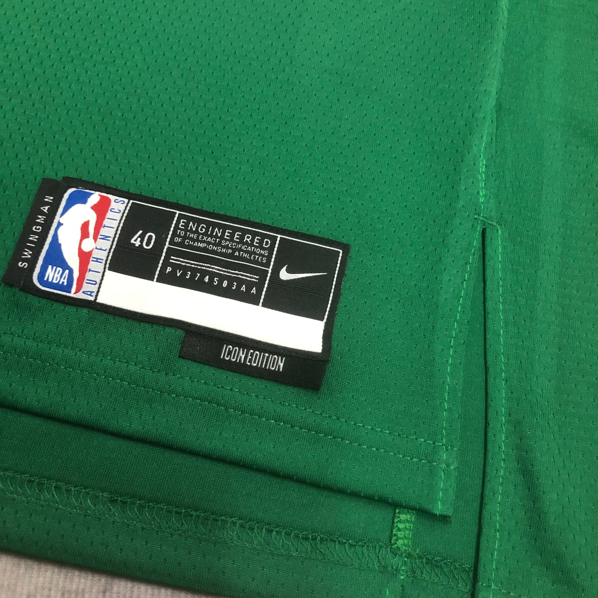 Boston Celtics Jayson Tatum number 0 green jersey front with white Boston lettering and striped trim