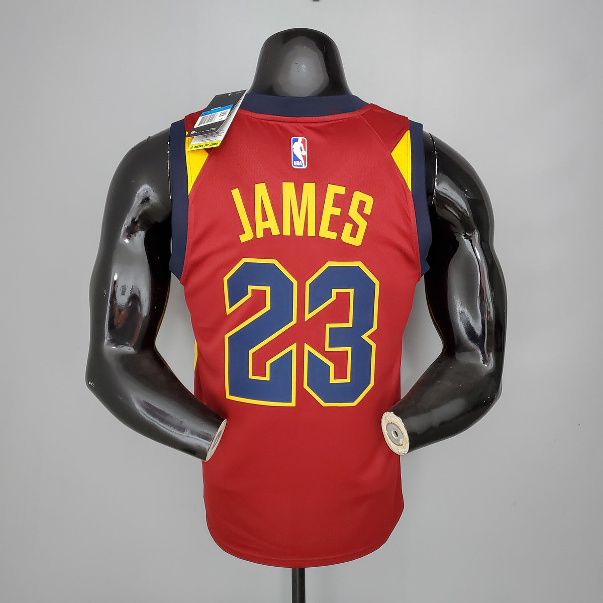 Gold James name and navy number 23 on the back of Cavaliers jersey