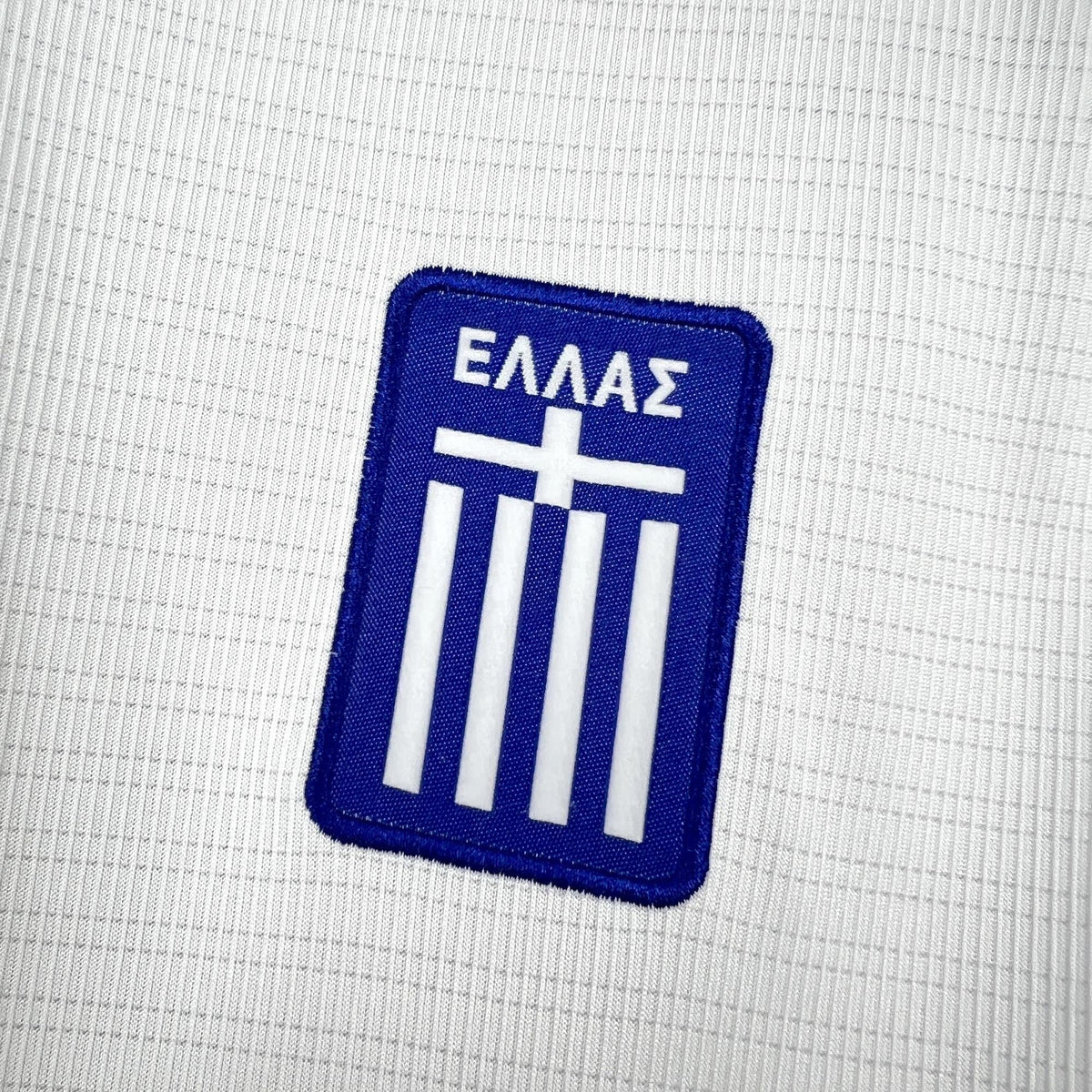 Back view of the white Greece Away Jersey 2026 with blue collar and shoulder trim