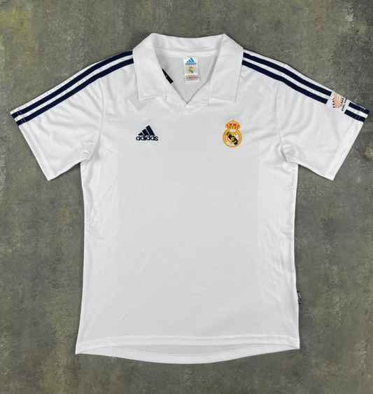 Back of white Real Madrid 2001/02 retro home jersey with dark shoulder stripes and plain back