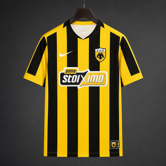 AEK Athens Home Jersey 2026/27 front view with yellow and black vertical stripes