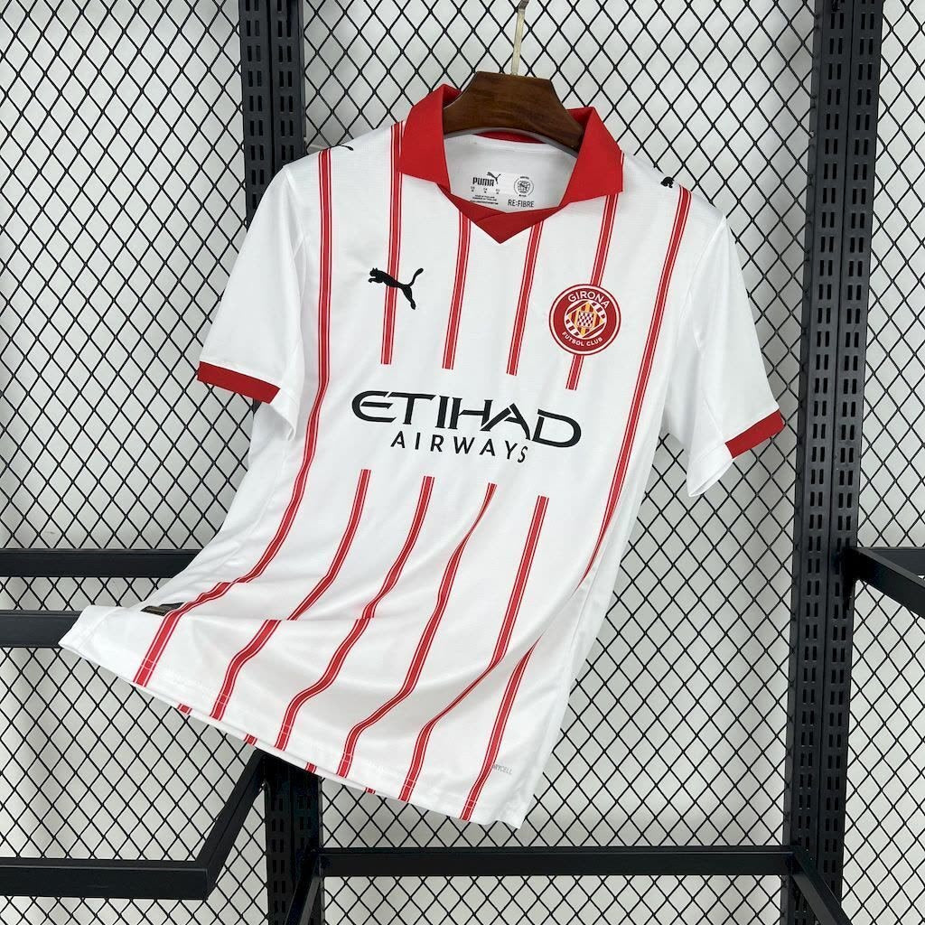 Close-up of the red stripe and fabric detail on the Girona 2025/26 home jersey