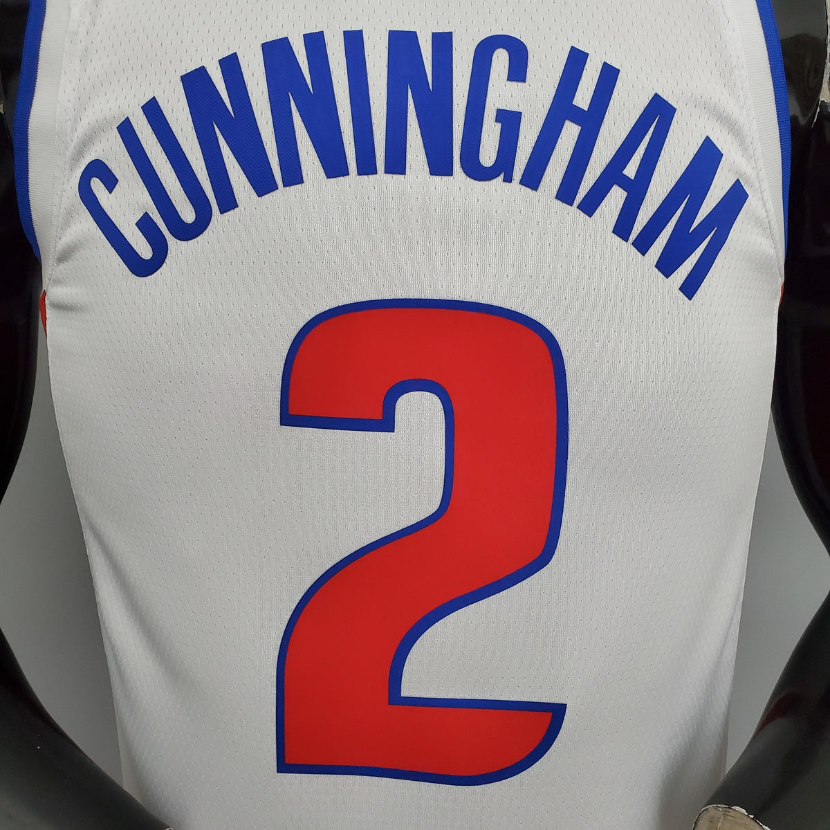 Blue Cunningham name and red number 2 on white Pistons jersey back