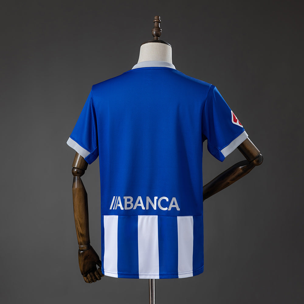 Close-up of the Deportivo La Coruña crest on the 2026/27 home jersey