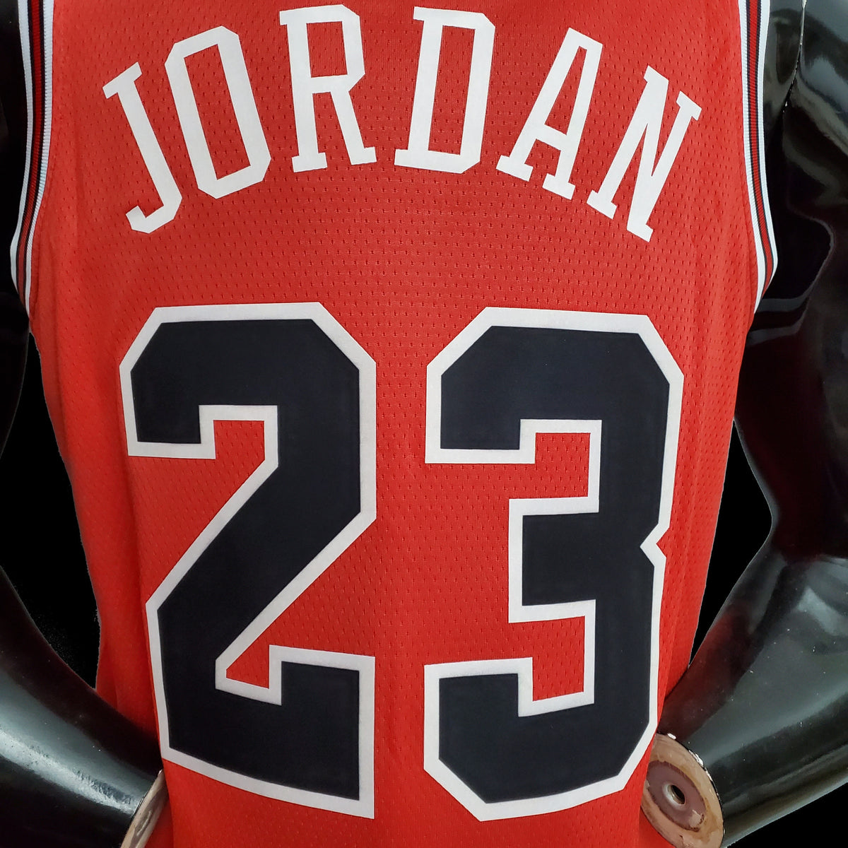 Jordan name and number 23 on the back of red Chicago Bulls jersey