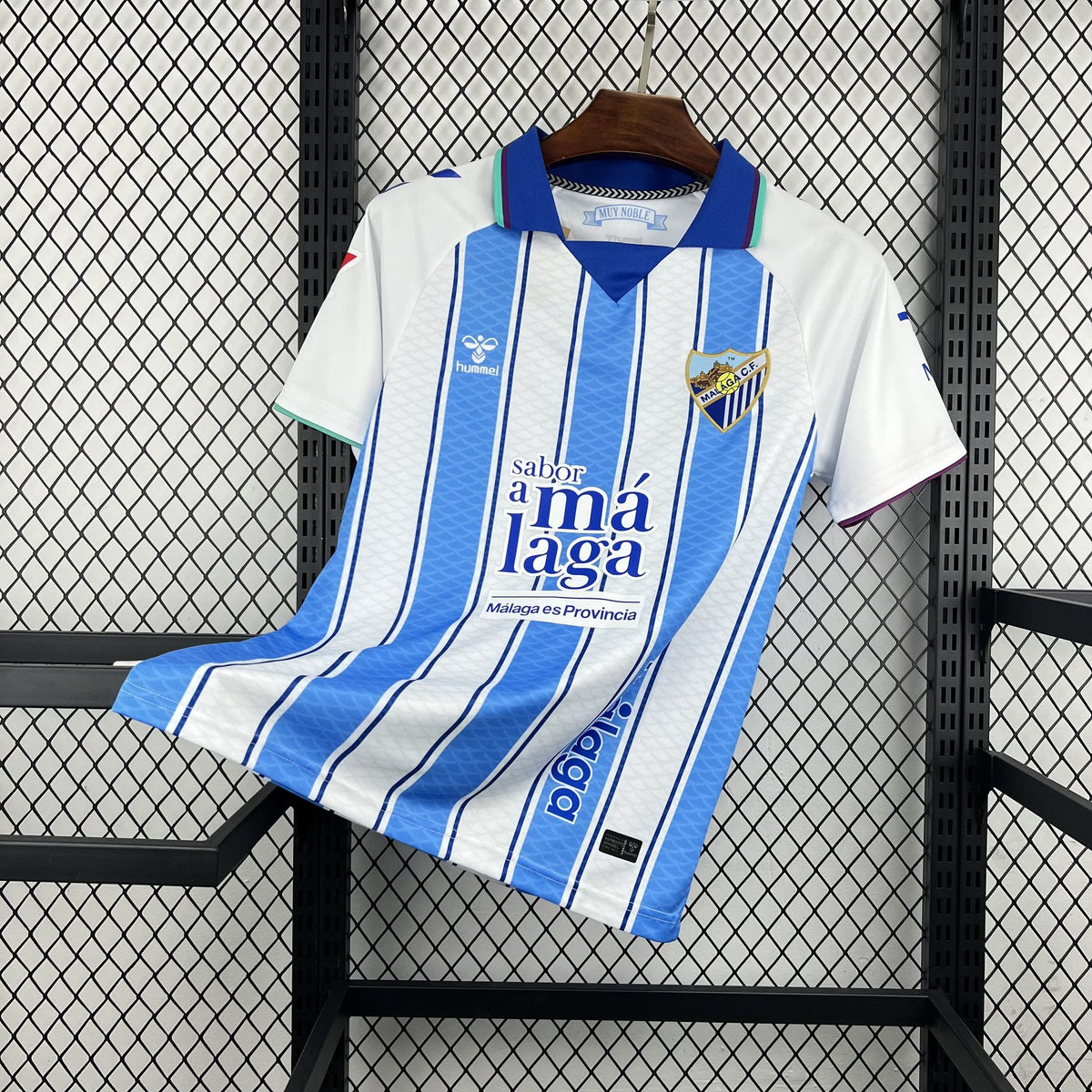 Front view of the white and light blue Málaga 2026/27 home jersey