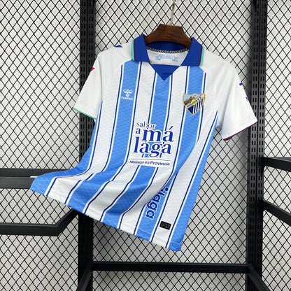 Front view of the white and light blue Málaga 2026/27 home jersey