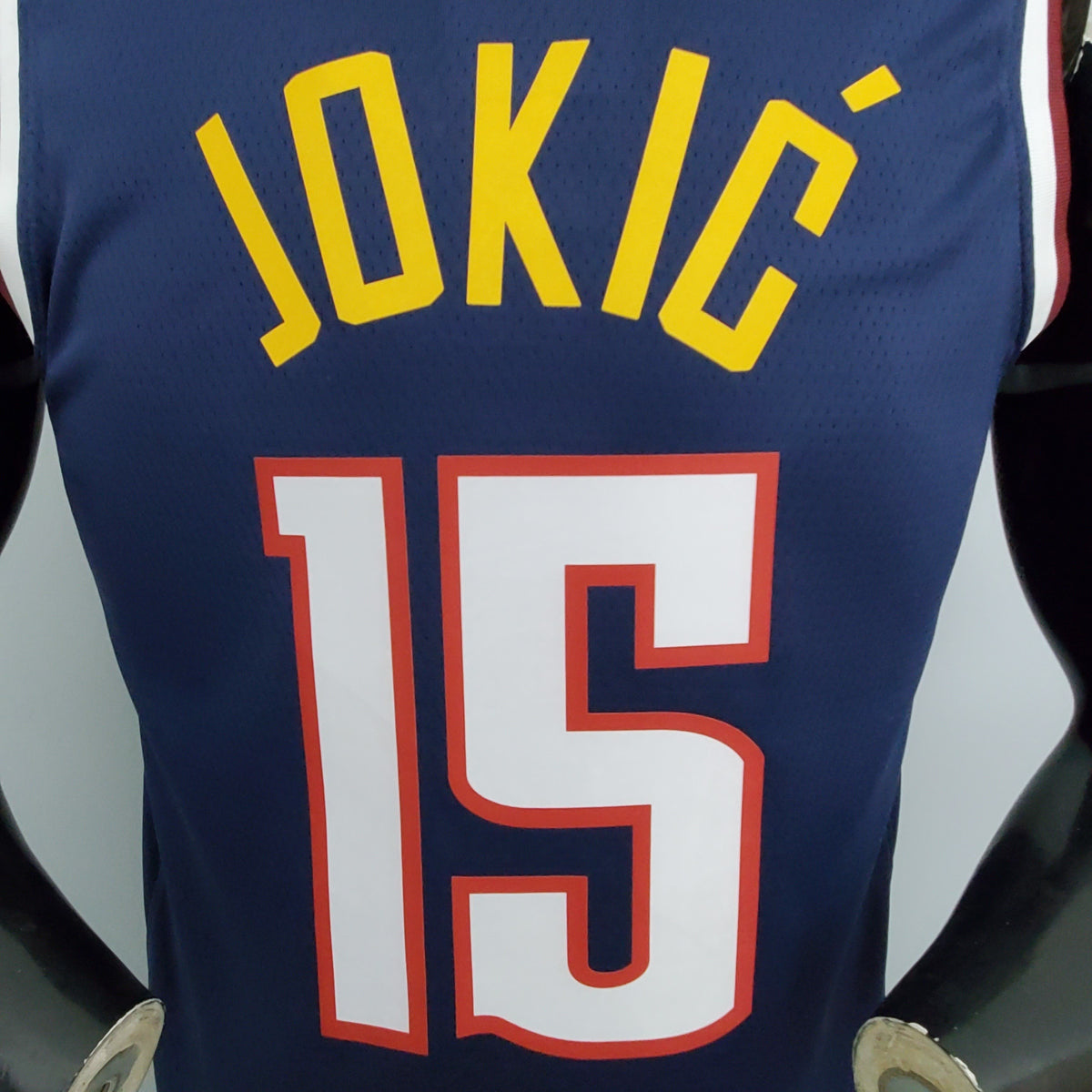 Denver Nuggets navy basketball jersey hem label close-up