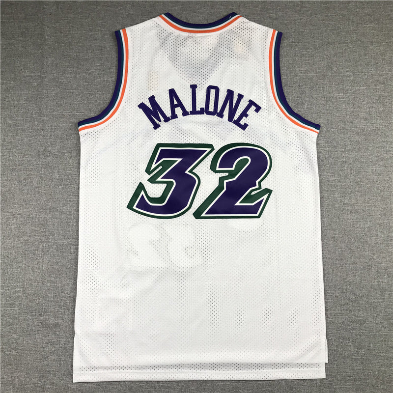 Purple mountain graphic Jazz lettering and number 32 detail on white jersey front