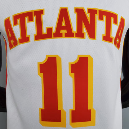 Close-up of Young name and red number 11 with yellow outline on white jersey back