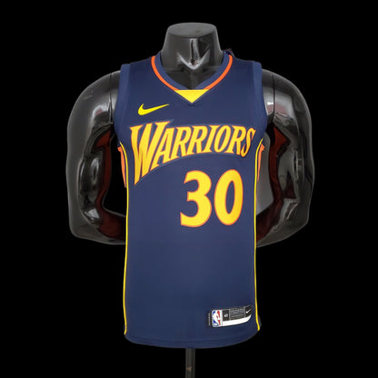 Gold Curry name and number 30 with orange outline on navy jersey back
