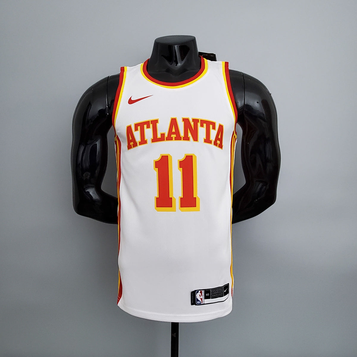 Atlanta Hawks Trae Young number 11 white basketball jersey front with red lettering and yellow trim