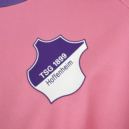 Purple-and-white Hoffenheim crest close-up on the Pink October Jersey 2025/26