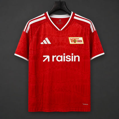 Union Berlin Home Jersey 2026/27 front view in red with tonal graphics, white trim and club crest