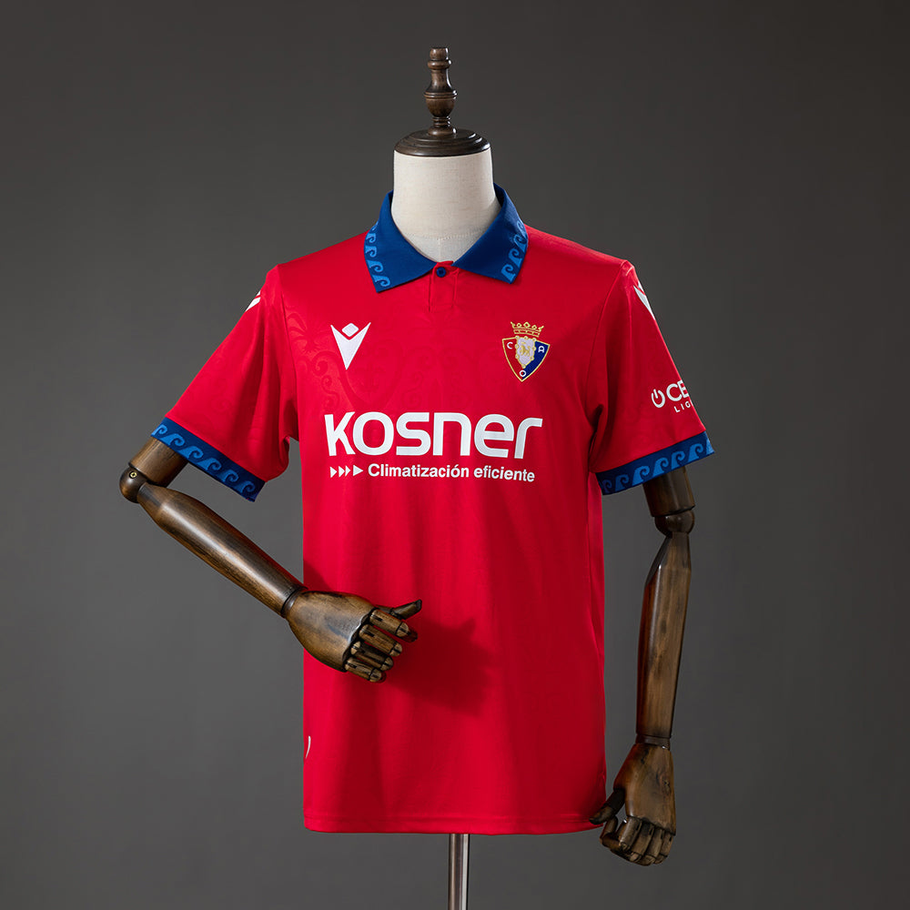 Front view of the red Osasuna 2026/27 home jersey with blue detailing