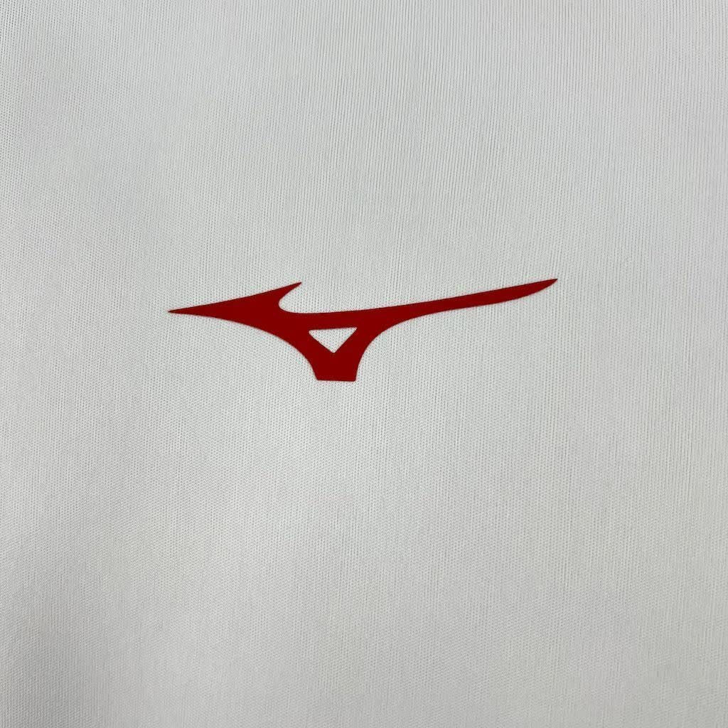 Close-up of the FC Augsburg crest on the 2025/26 home jersey