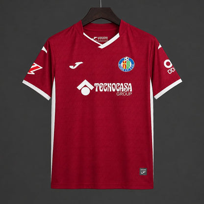 Front view of the red Getafe 2026/27 away jersey with white detailing