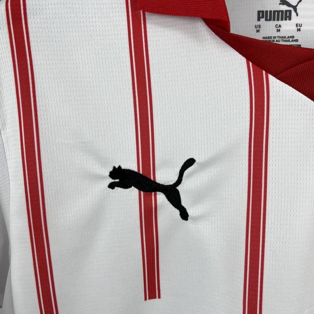 Close-up of the Girona crest on the 2025/26 home jersey