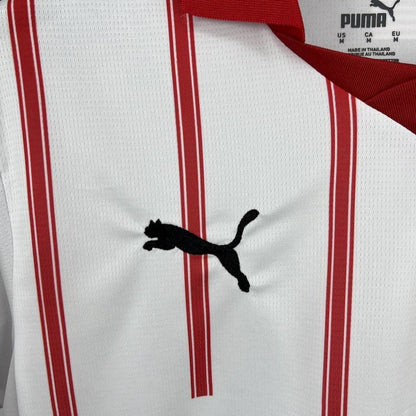 Close-up of the Girona crest on the 2025/26 home jersey