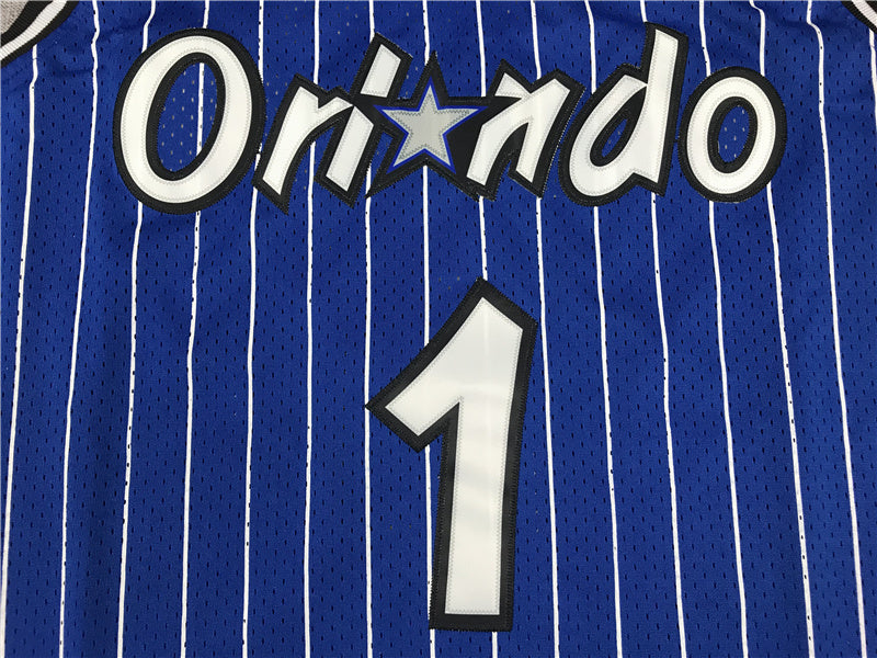 White McGrady lettering and number 1 back detail on blue pinstripe Magic jersey