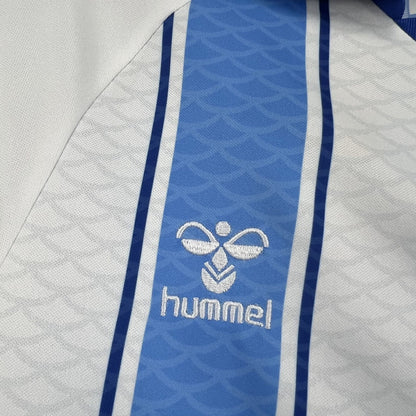 Back view of the white and light blue Málaga 2026/27 home jersey