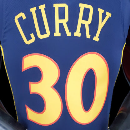 Gold Warriors lettering and number 30 outlined in orange on navy jersey