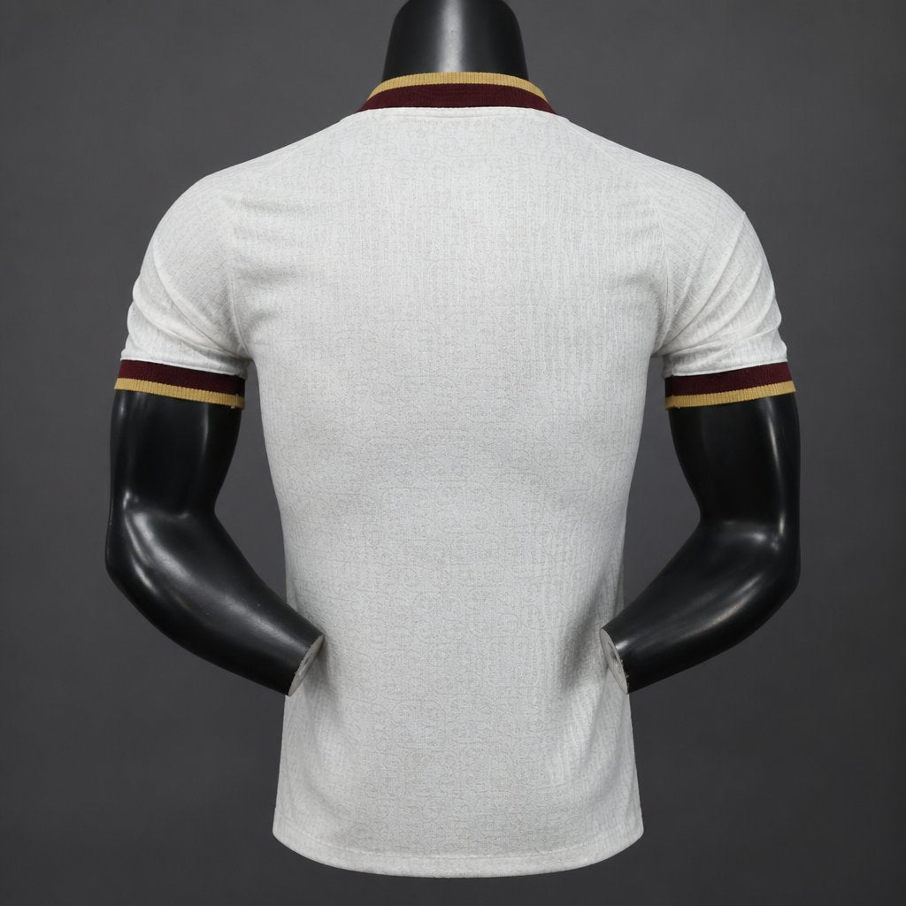Front view of the white Spain 2026 World Cup Champions home jersey with red and gold trim