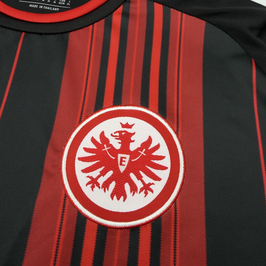 Close-up of the Eintracht Frankfurt crest on the 2026/27 home jersey