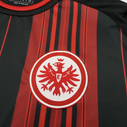 Close-up of the Eintracht Frankfurt crest on the 2026/27 home jersey