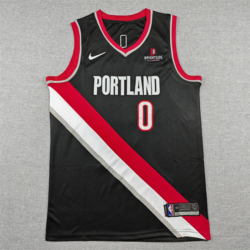 Damian Lillard name and white number 0 with red edging on black jersey back detail