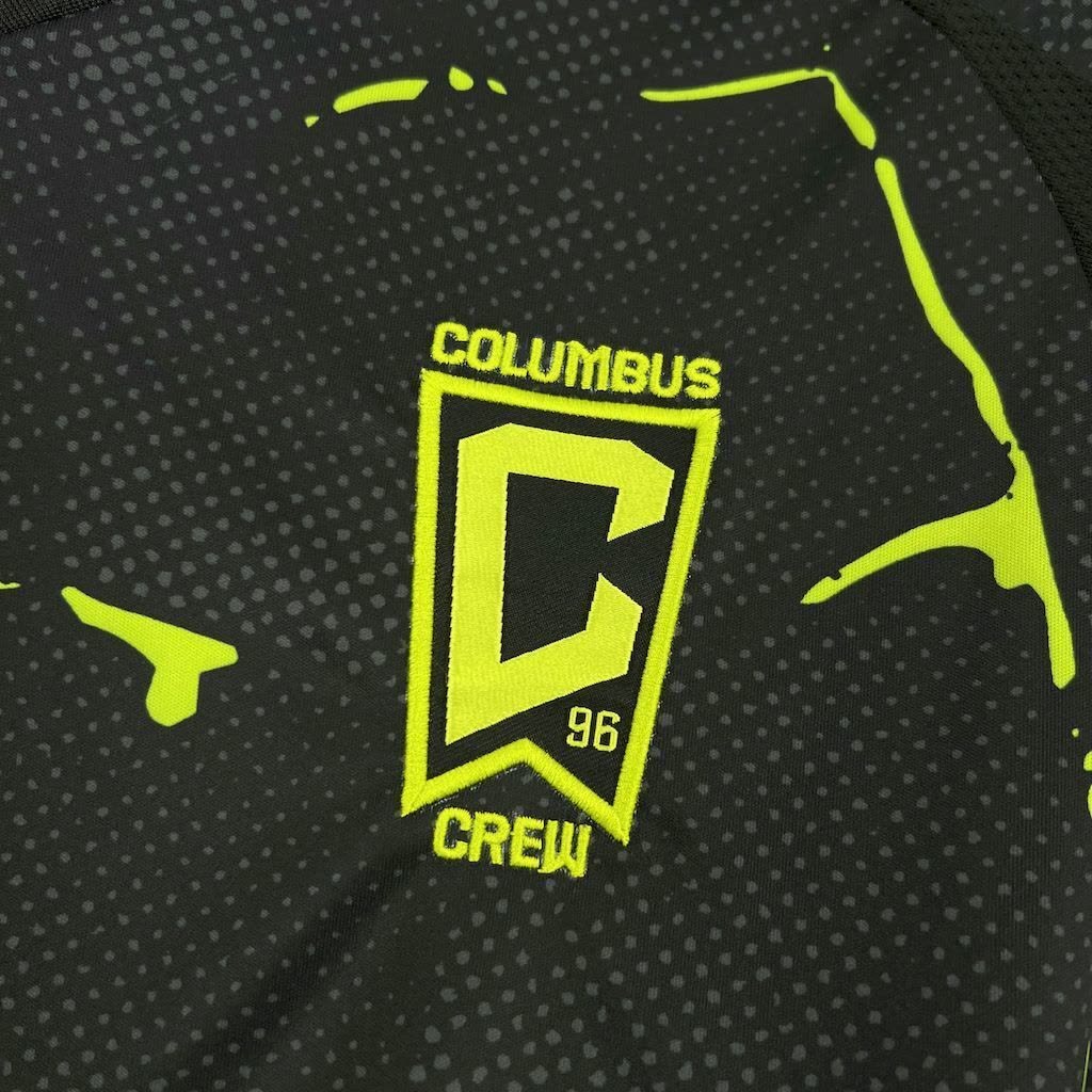 Columbus Crew Away Jersey 2025/26 yellow chest logo and dotted fabric close-up