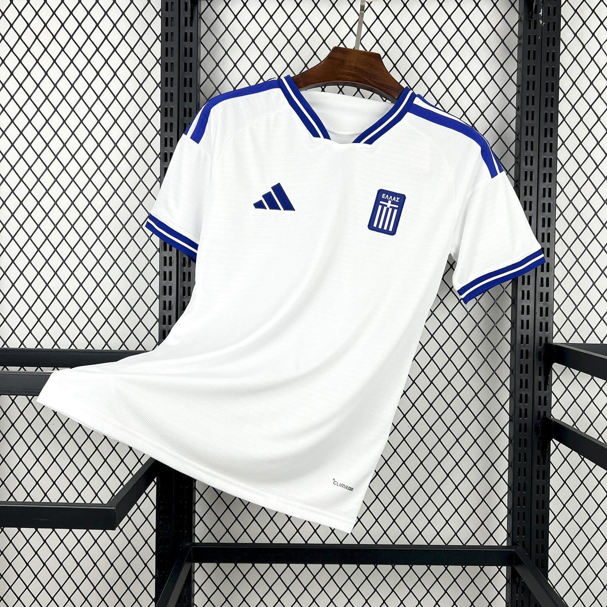Front view of the white Greece Away Jersey 2026 with blue collar, shoulder, and sleeve trim